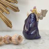 Frog carries bouquet