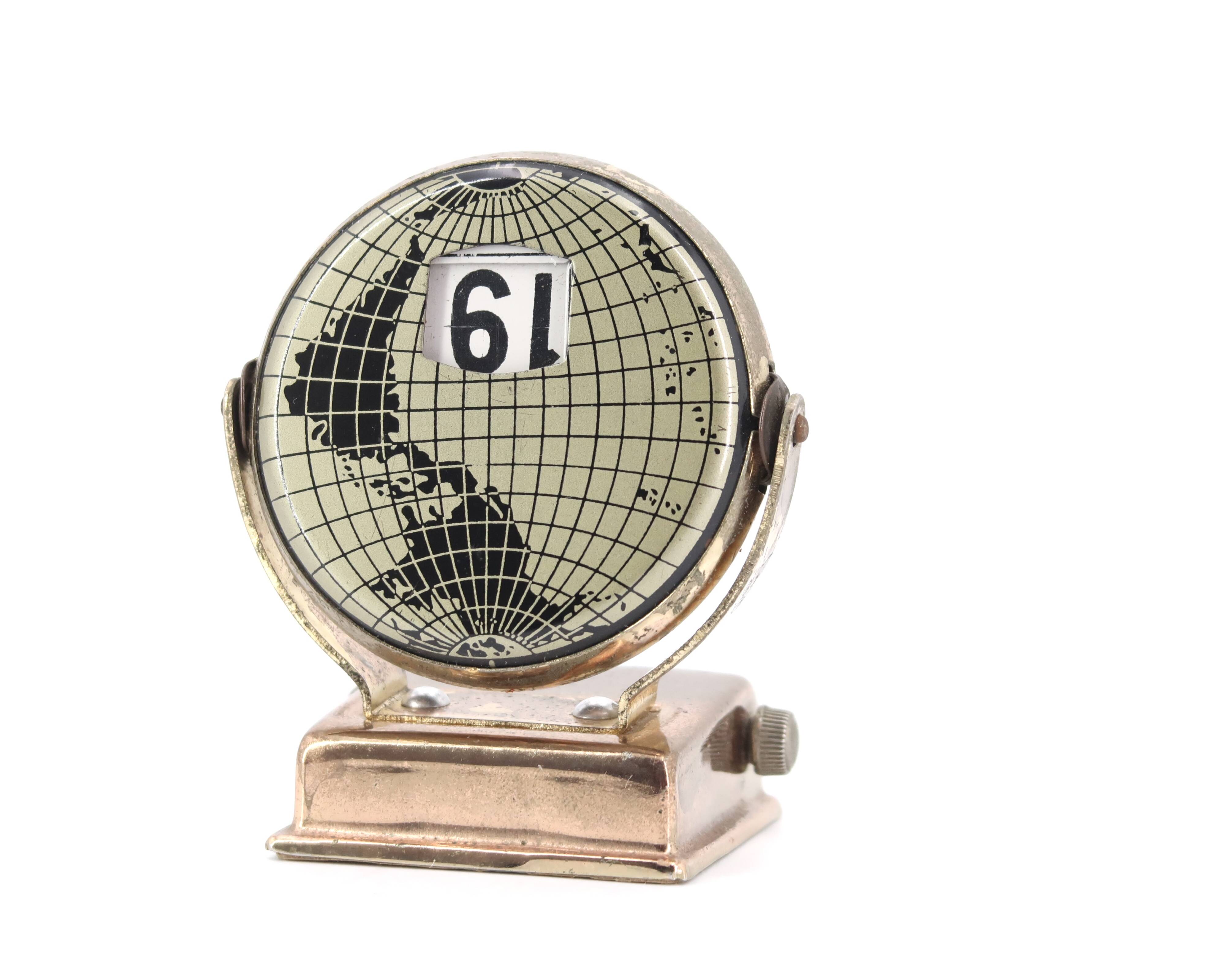 World map perpetual calendar paperweight, 1950s