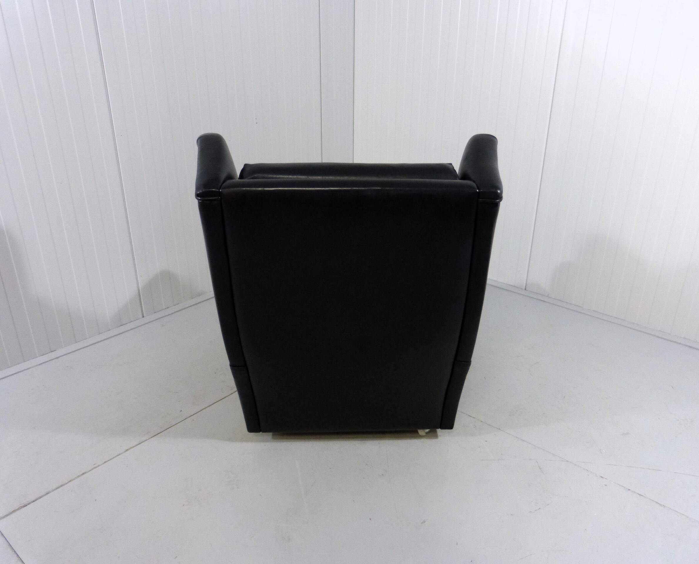 Black leather wingback chair on wheels 1960’s