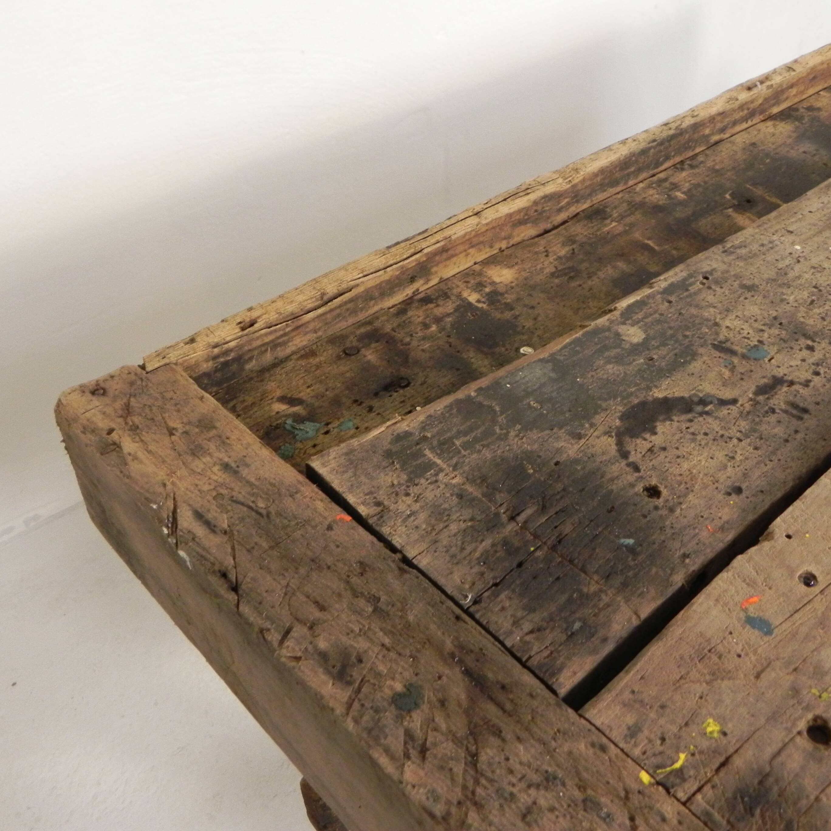 Wooden industrial workbench with vice, 194 cm long, 1930s.