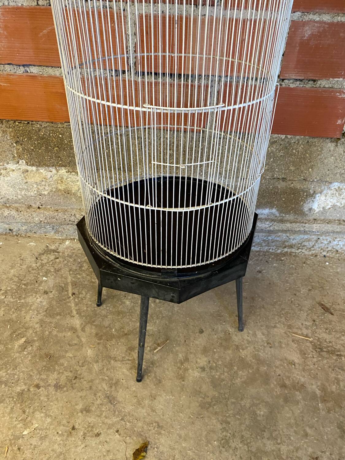 Antique black & white metal bird cage on vintage decorative legs