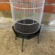 Antique black & white metal bird cage on vintage decorative legs