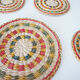 Set of coasters and bottles in colored wicker