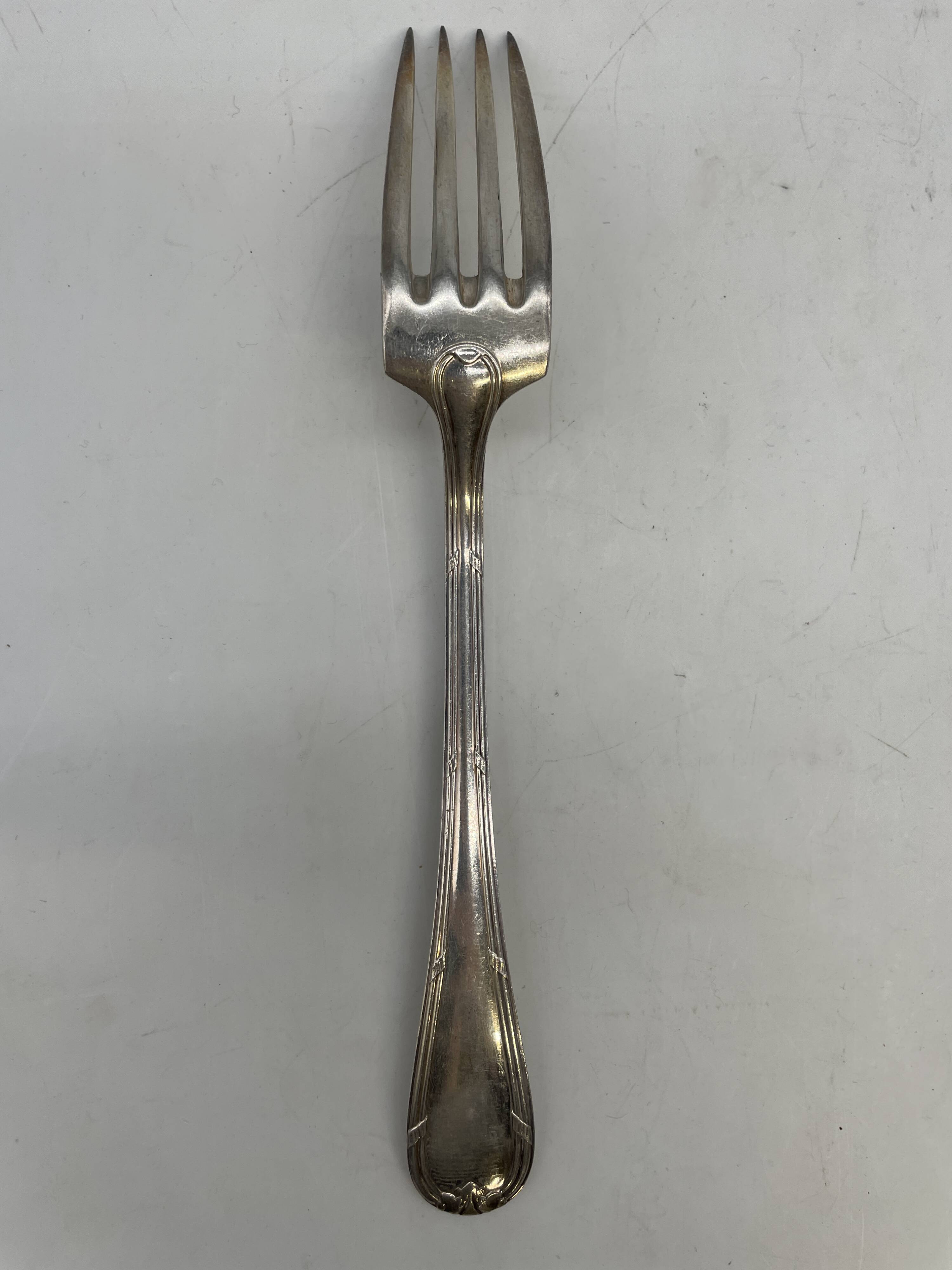 Set of 12 soup spoons and 6 silver-plated lunch forks.
