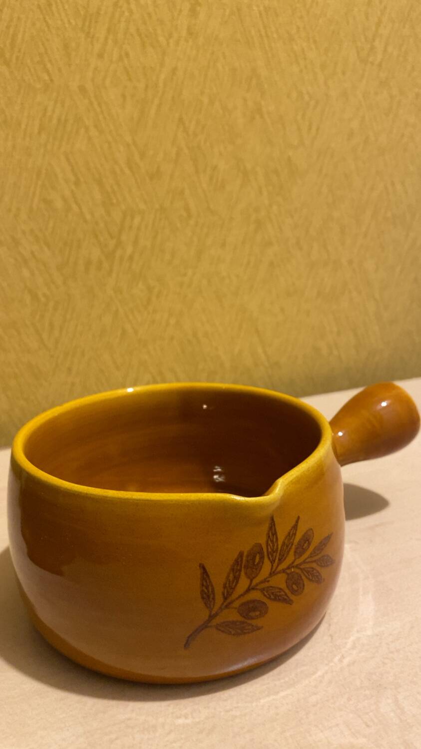 Glazed yellow earthenware fondue pot