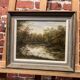 Peinture représentant un lac au milieu de la forêt