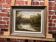 Peinture représentant un lac au milieu de la forêt