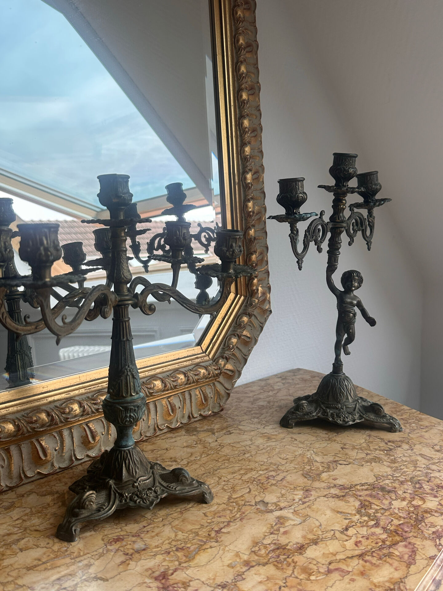 Set of 3 antique three-branch candelabras with cherubs and bronze patina.