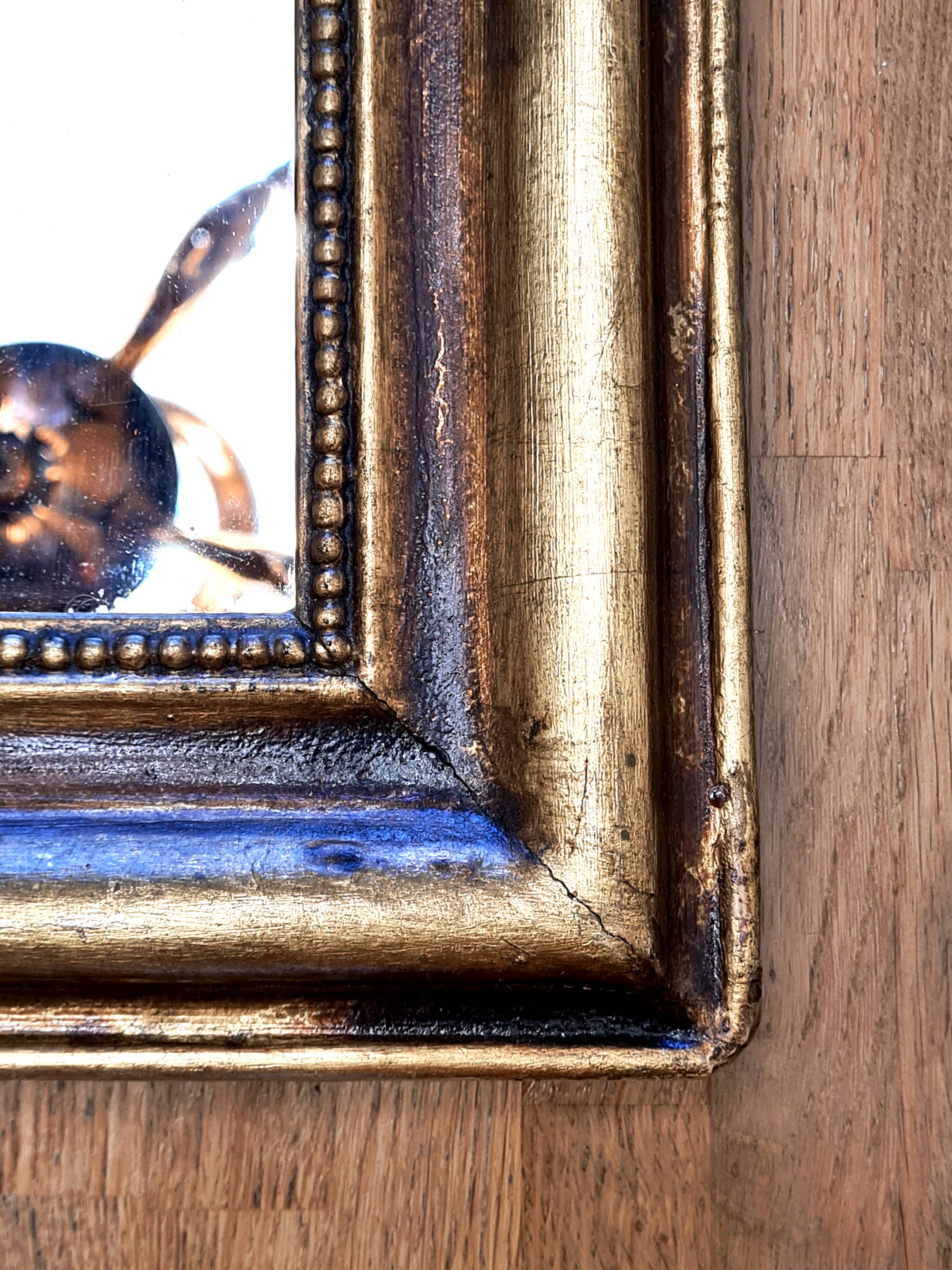 Antique Louis-Philippe gilded mirror “Apoline”