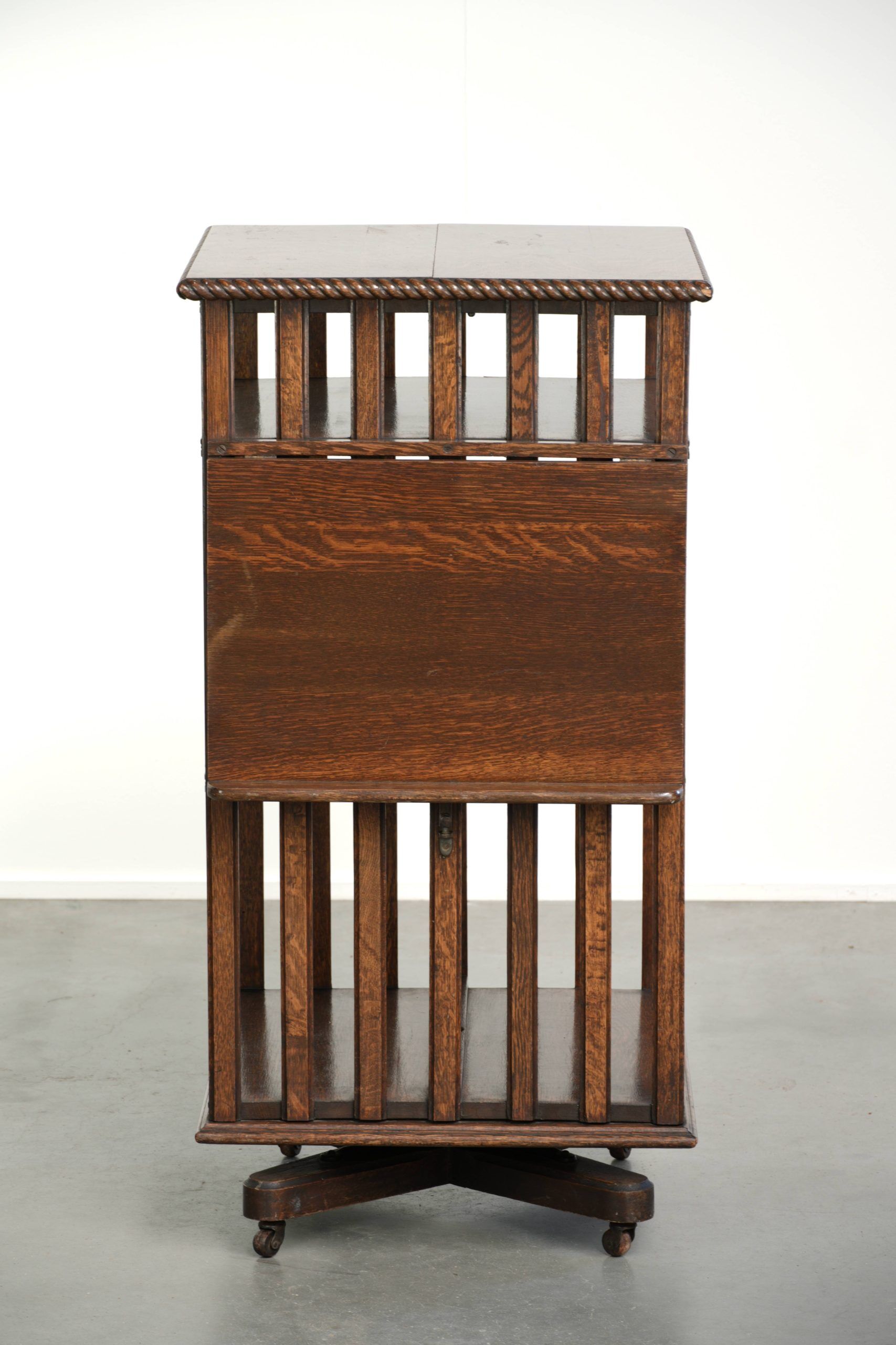 Large antique English oak book carousel from the 19th century