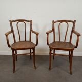Pair of curved wooden bistro armchairs