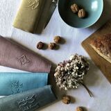 Suite of four tinted antique napkins