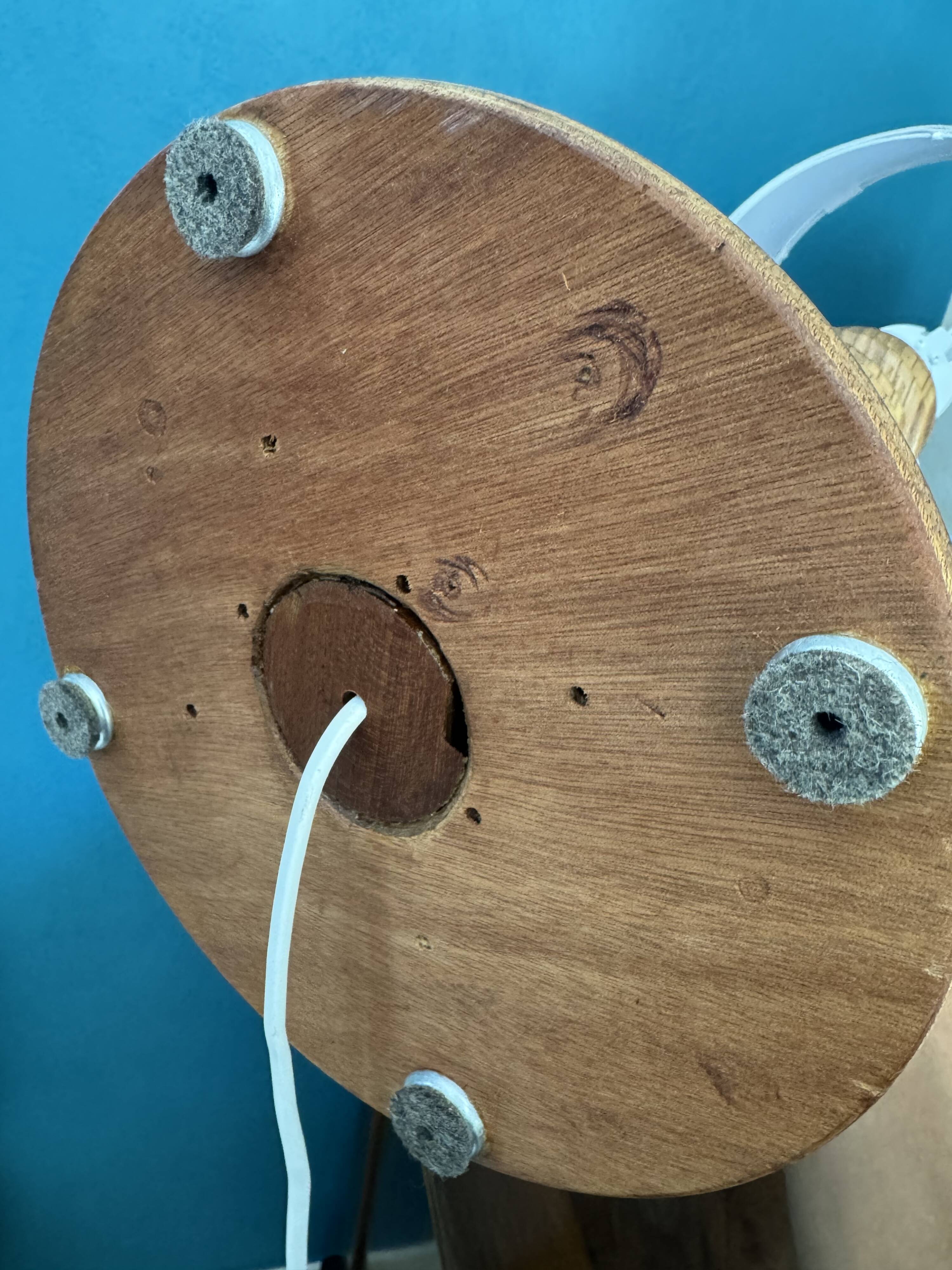 Wooden turned totem lamp with a linen shade in a vintage Scandinavian style.