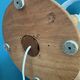 Wooden turned totem lamp with a linen shade in a vintage Scandinavian style.