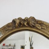 Oval wall mirror, golden floral pattern in stucco and wood, late 19th century