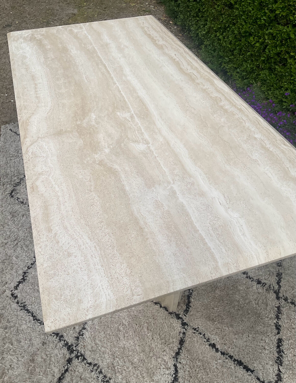 Large vintage dining table in travertine in the 1970s Carpa style.