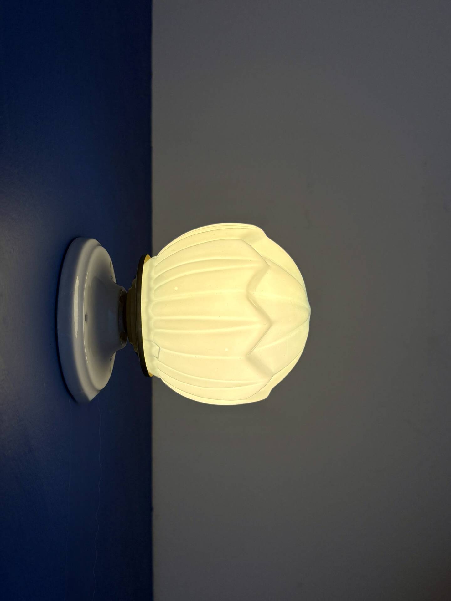 Vintage Art Deco globe wall light in blue opaline.