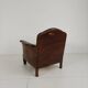 Antique leather club chair with stud detailing