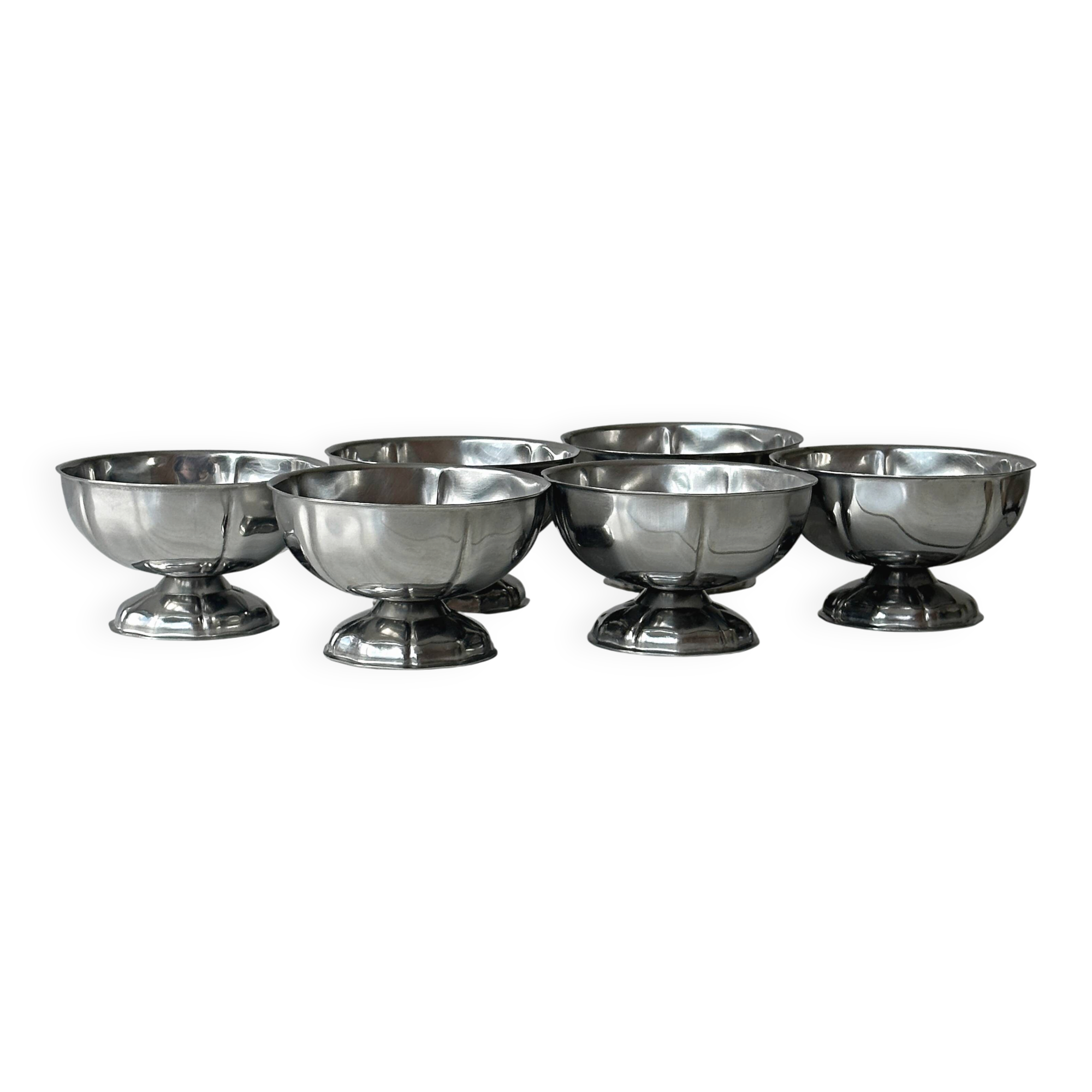 Set of 6 silver stainless steel ice cream bowls on a stand.