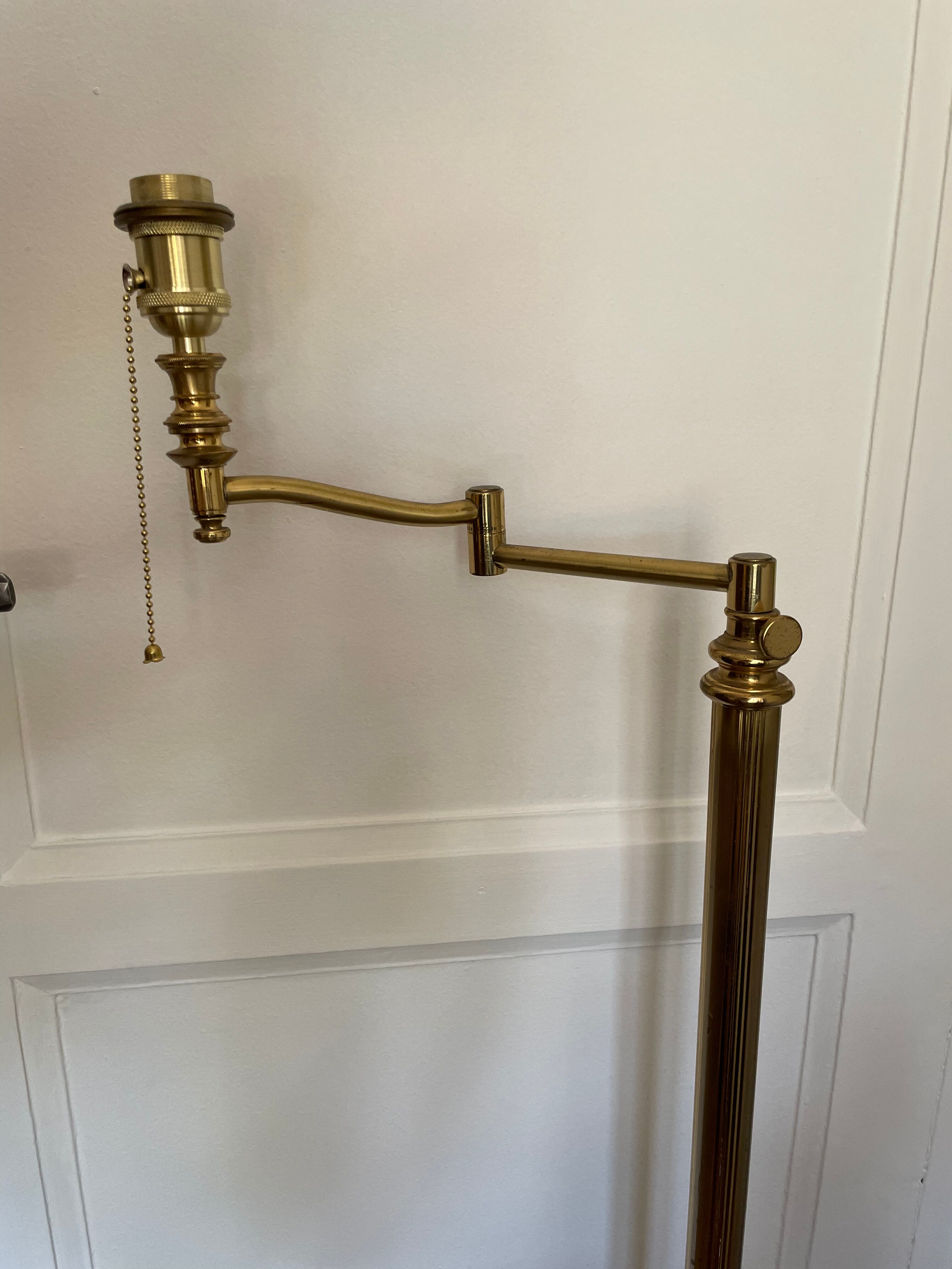 Articulated brass and gold metal floor lamp
