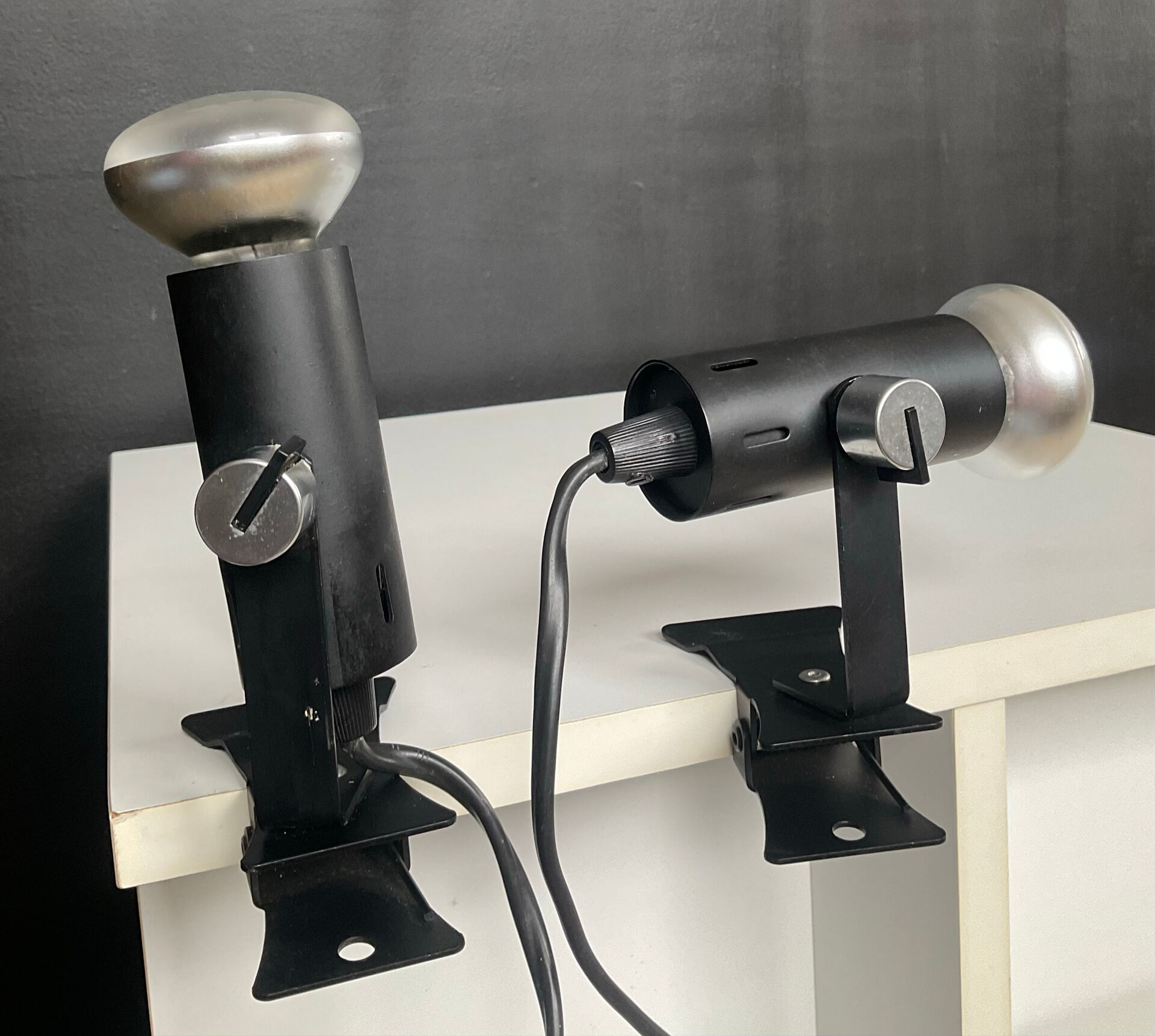 A pair of clamp lamps from the 1970s.