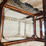 Two rattan and glass bedside tables