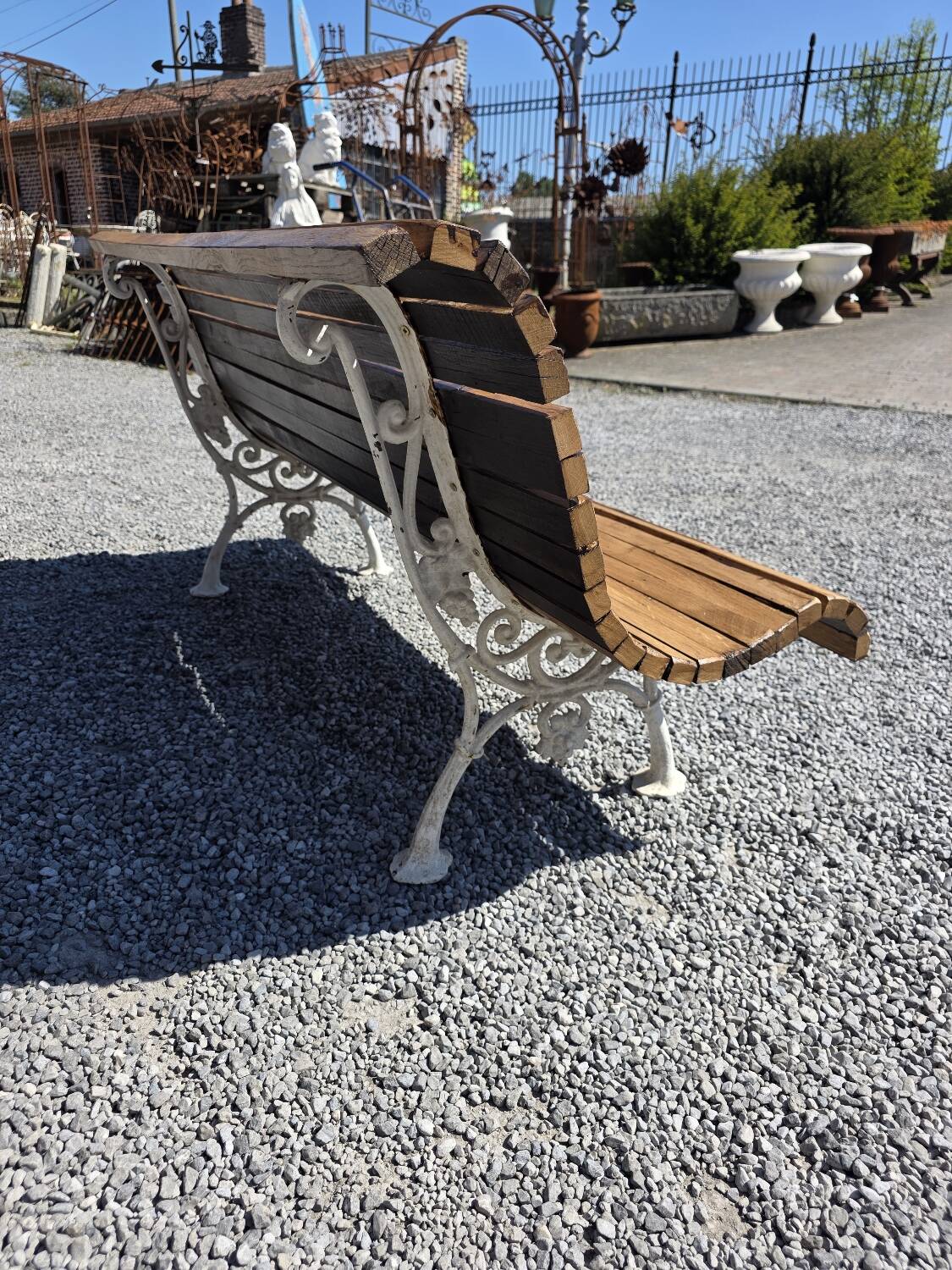Antique garden bench made of cast iron and oak slats