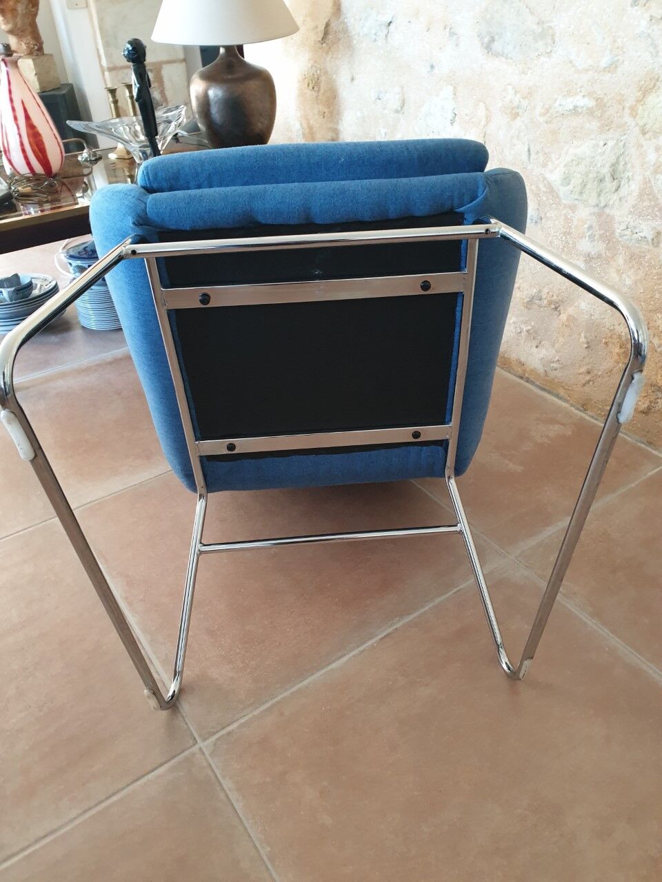 Armchair and its footrest