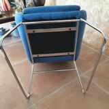 Armchair and its footrest