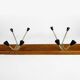 Wall coat rack with golden metal hooks from the 60s