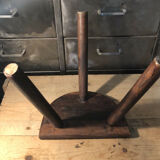 Wooden milking stool on tripod base