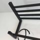 Designer coat rack in blackened metal