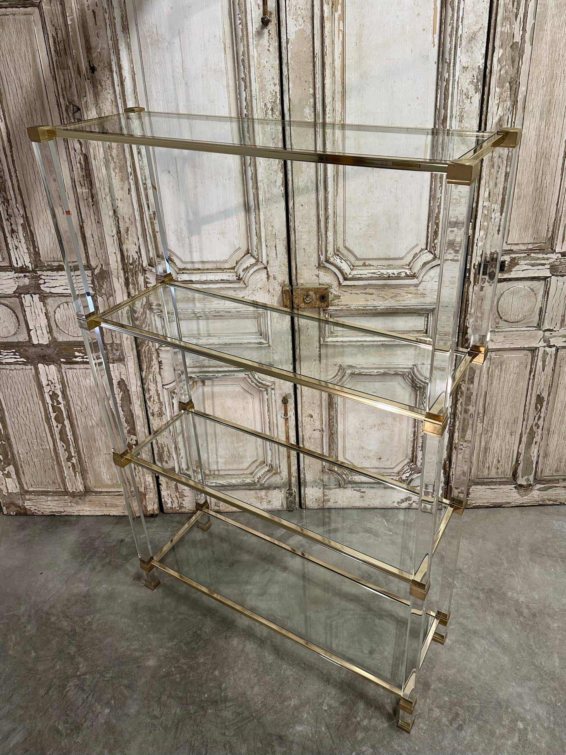 Plexiglass shelf by Pierre Vandel in Hollywood Regency style circa 1970.