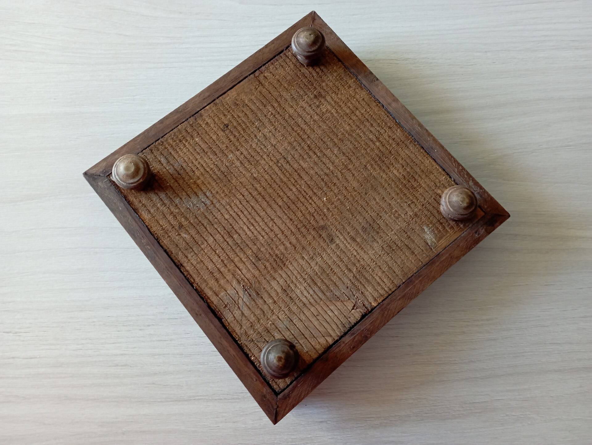 Old wood and ceramic trivet