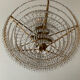 Chandelier cascade of tassels and brass