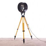 Old industrial spot on wooden tripod