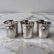 Set of 3 small silver 970 sterling cups with enamelled flags from the 20th century.