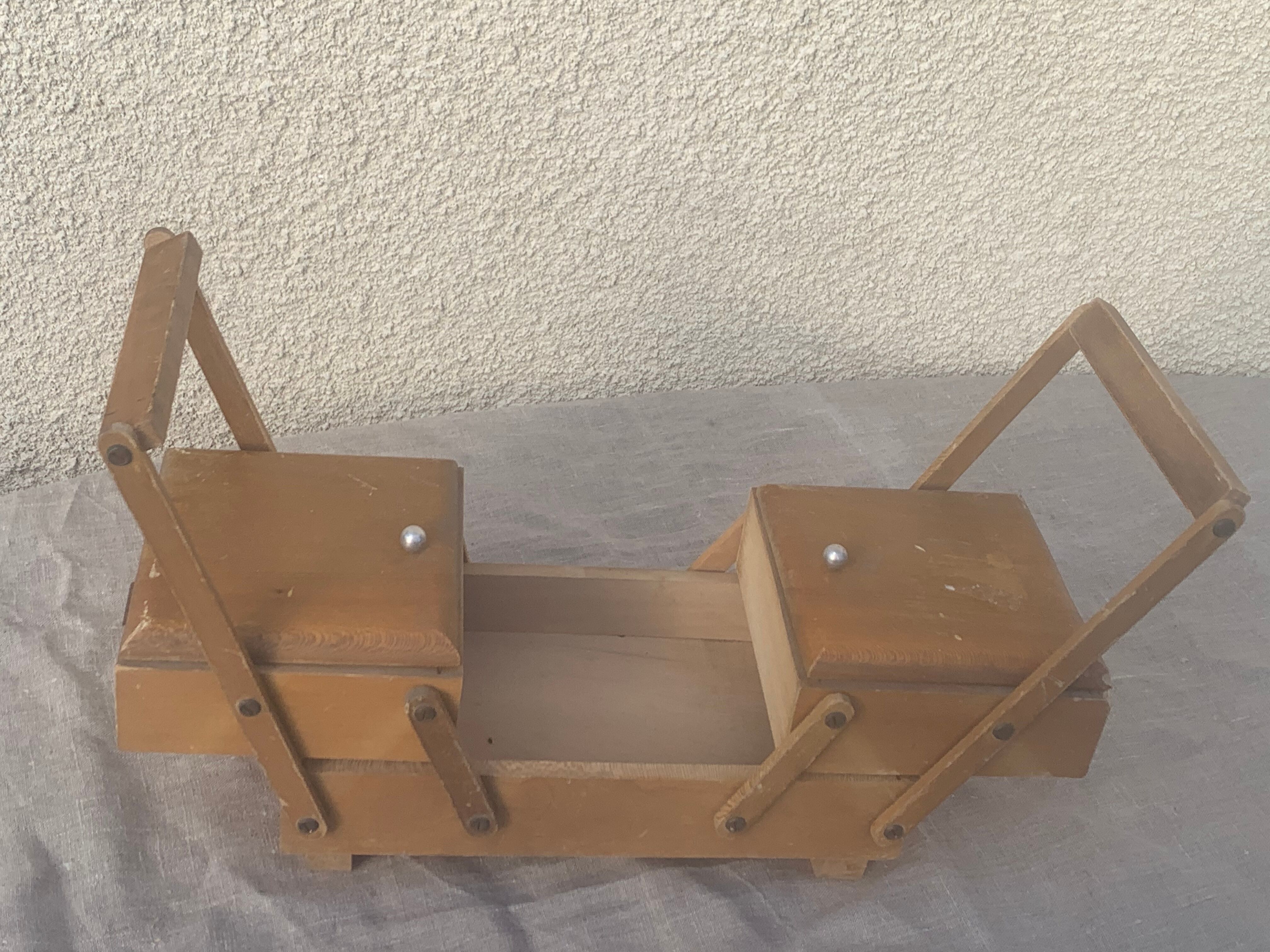 Sewing box in old varnished wood
