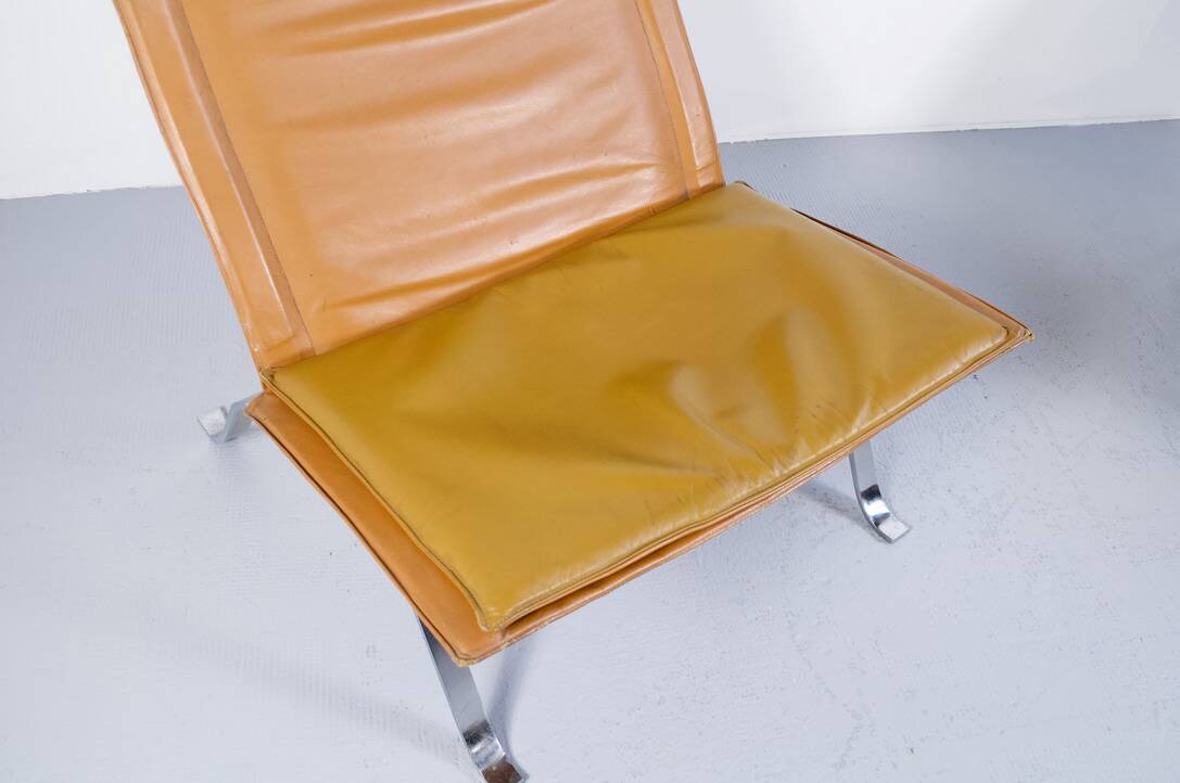 Imposing pair of leather and steel armchairs from the 1960s