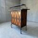 Vintage wooden bar counter with ceramic accents.