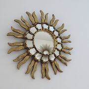 Golden wooden sun mirror with inlays from the early 20th century.