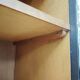 Wardrobe trunk on casters in mahogany and woven rattan.