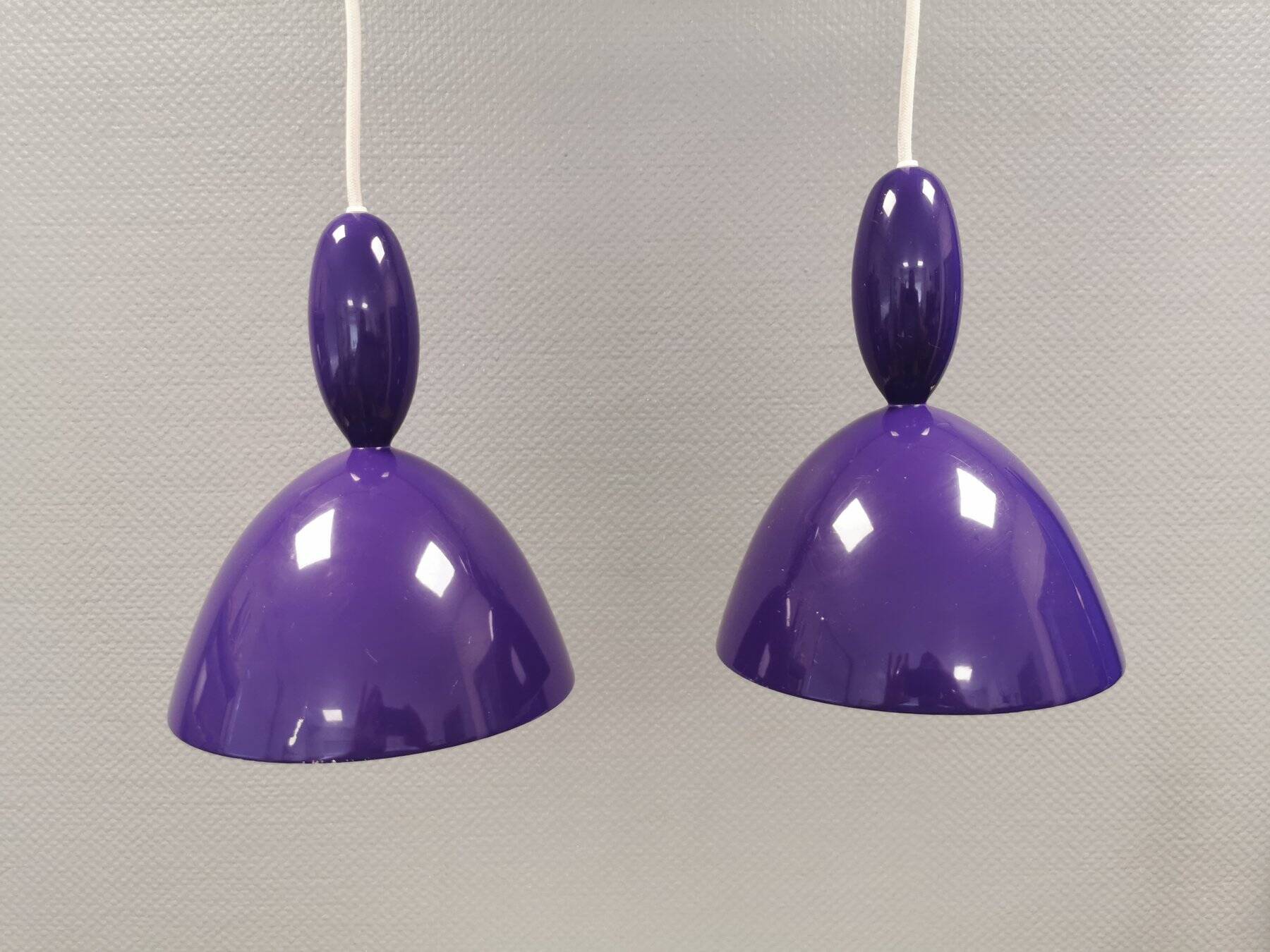 Two purple hanging lamps from Norway Says for Muuto, model Mhy