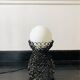 Handcrafted wrought iron lamp with a white opaline globe.
