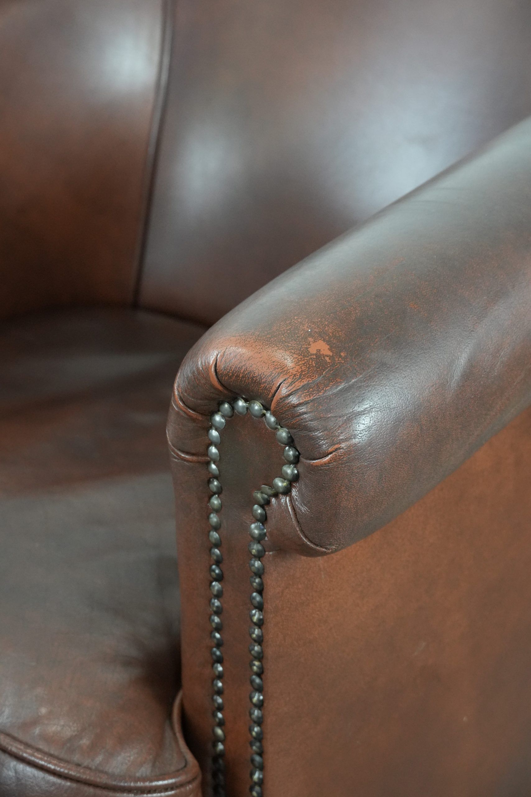 Cognac-coloured cow leather club armchair in English style