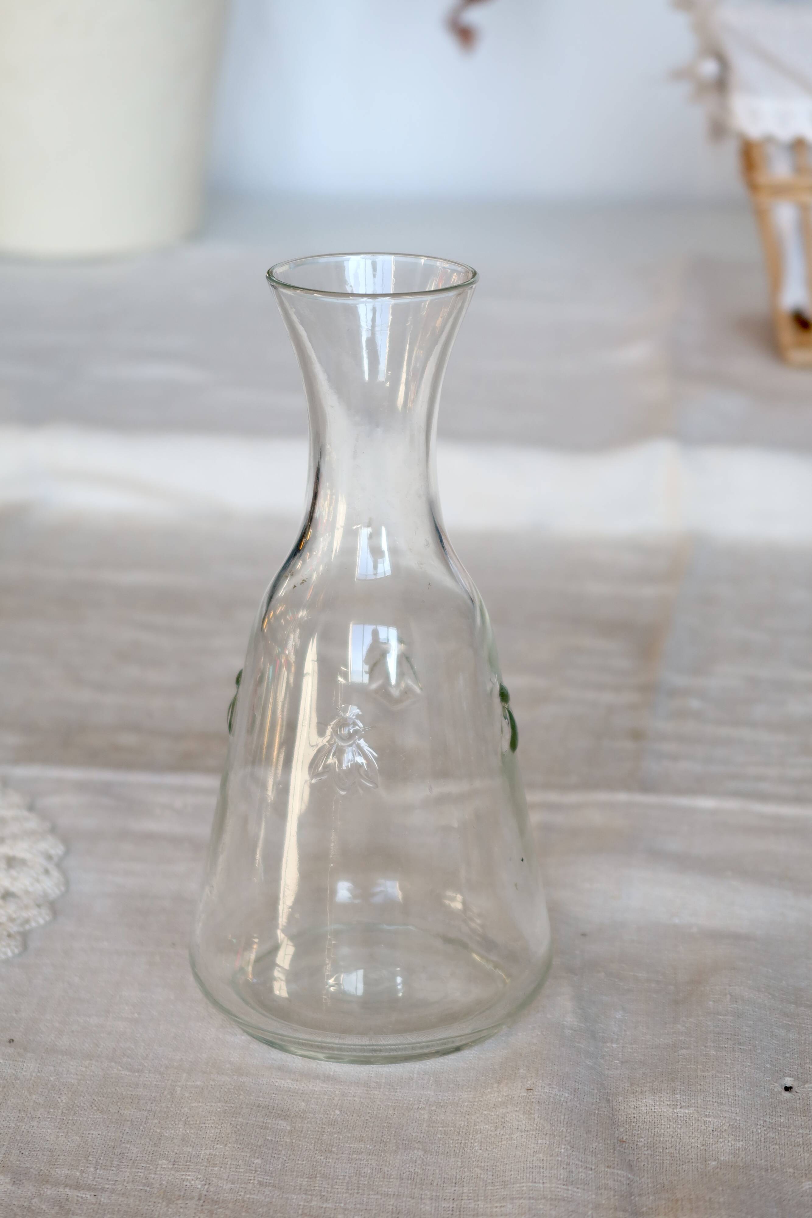 Vintage glass carafe with embossed bee motifs
