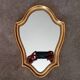 Vintage baroque mirror in gilded wood in the Louis XV style.