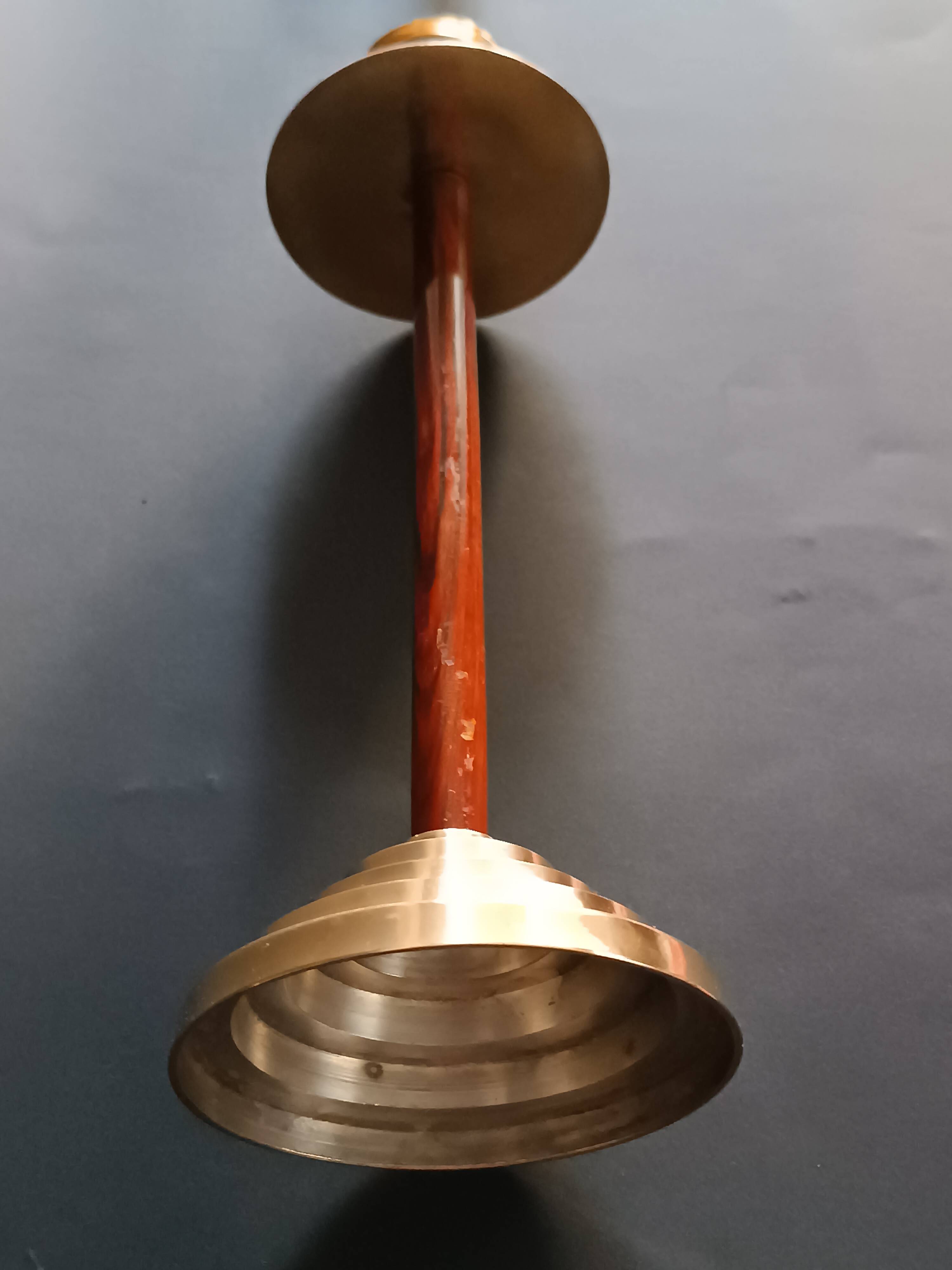Two vintage wooden and brass candlesticks.