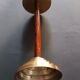Two vintage wooden and brass candlesticks.