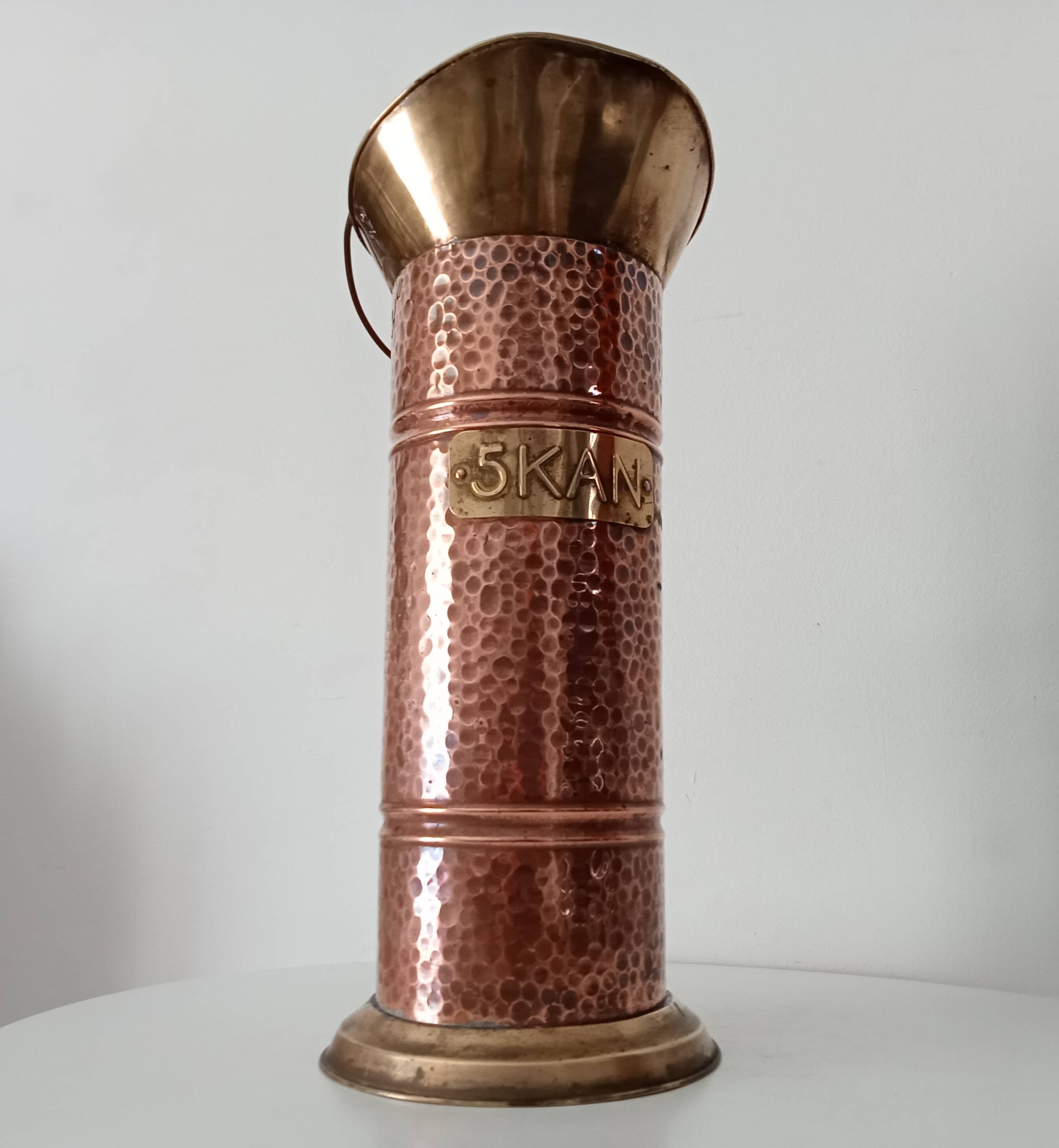 Old umbrella stand in copper, brass and porcelain